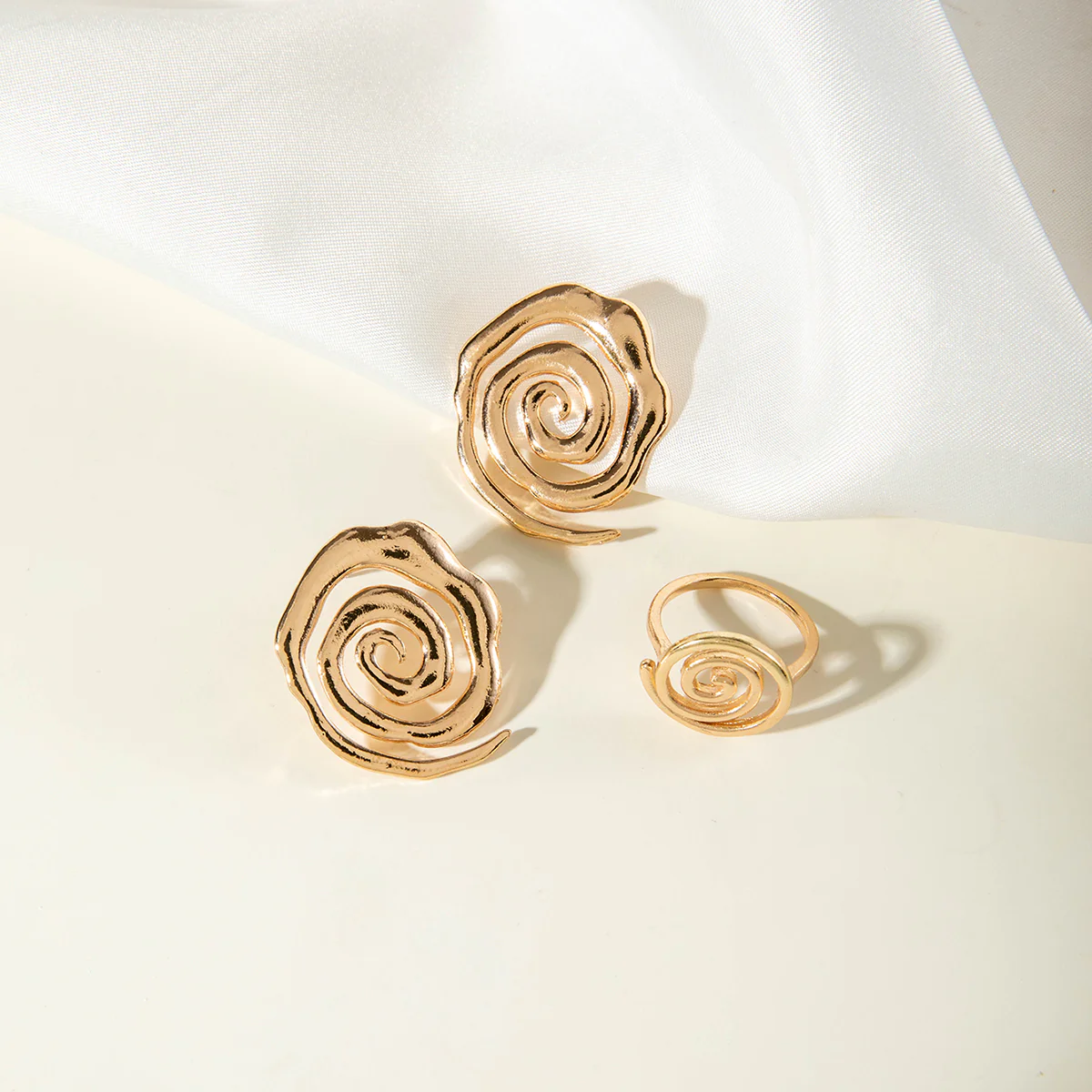 Gold Spiral Stud Earrings & Ring Stack - Image 2