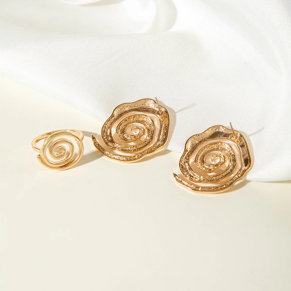 Gold Spiral Stud Earrings & Ring Stack - Image 3